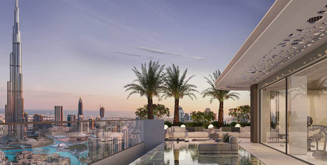 Luxurious rooftop terrace with city skyline and palm trees at sunset.