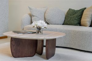 Modern living room with cozy sofa and stylish coffee table, showcasing contemporary interior design.