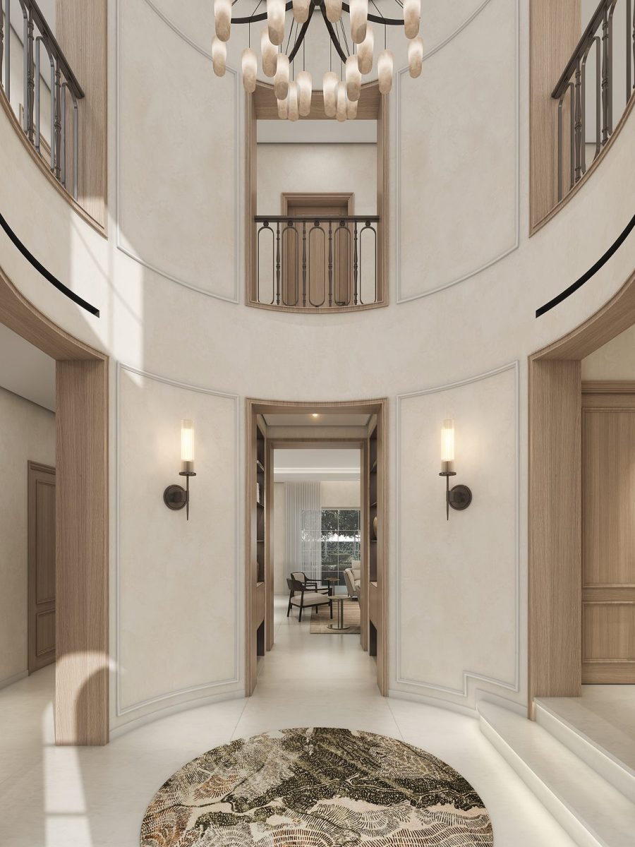 Double-height foyer of the Arabian Ranches villa with a chandelier