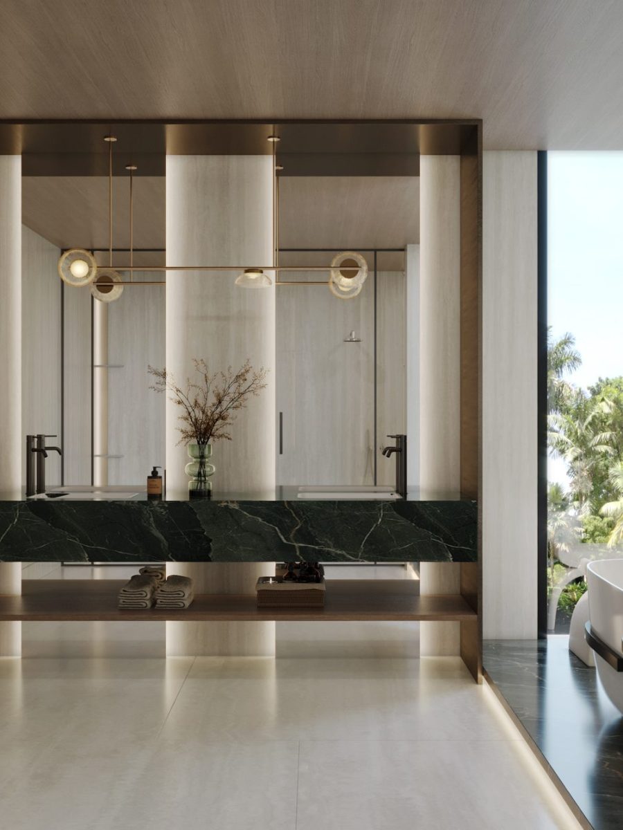 Master bedroom of the Nad Al Sheba villa opening onto a marble bathroom and the garden beyond