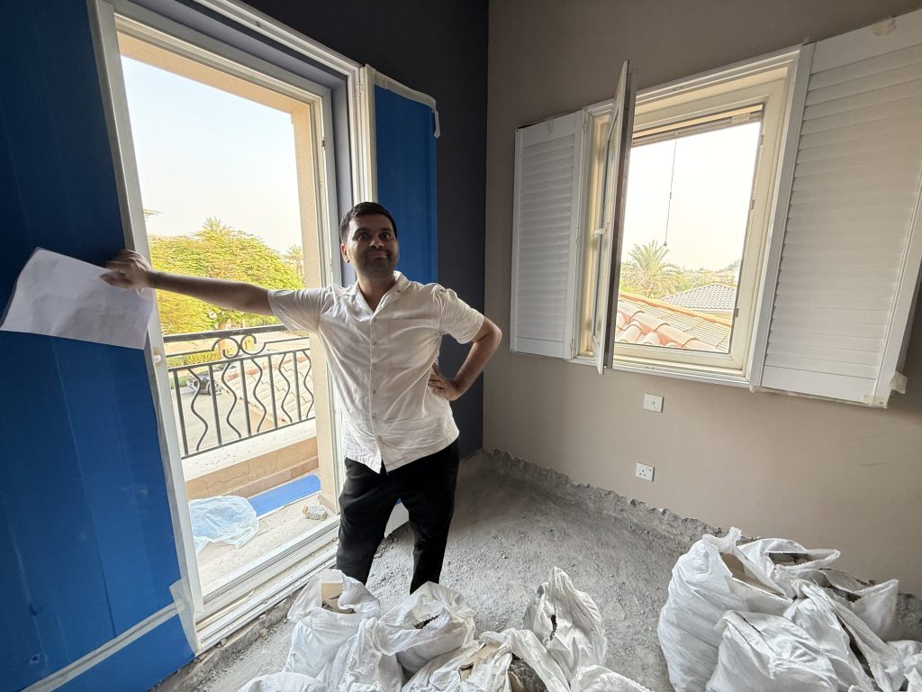 An Elementa designer on site with the plans during a villa renovation